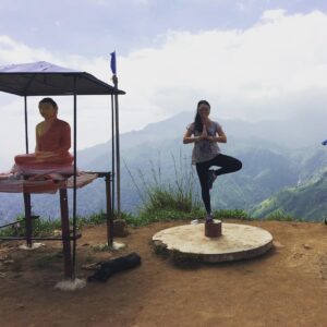 Picture of EnlightenHarmony admin in a yoga pose on a Mountain in Sri Lanka